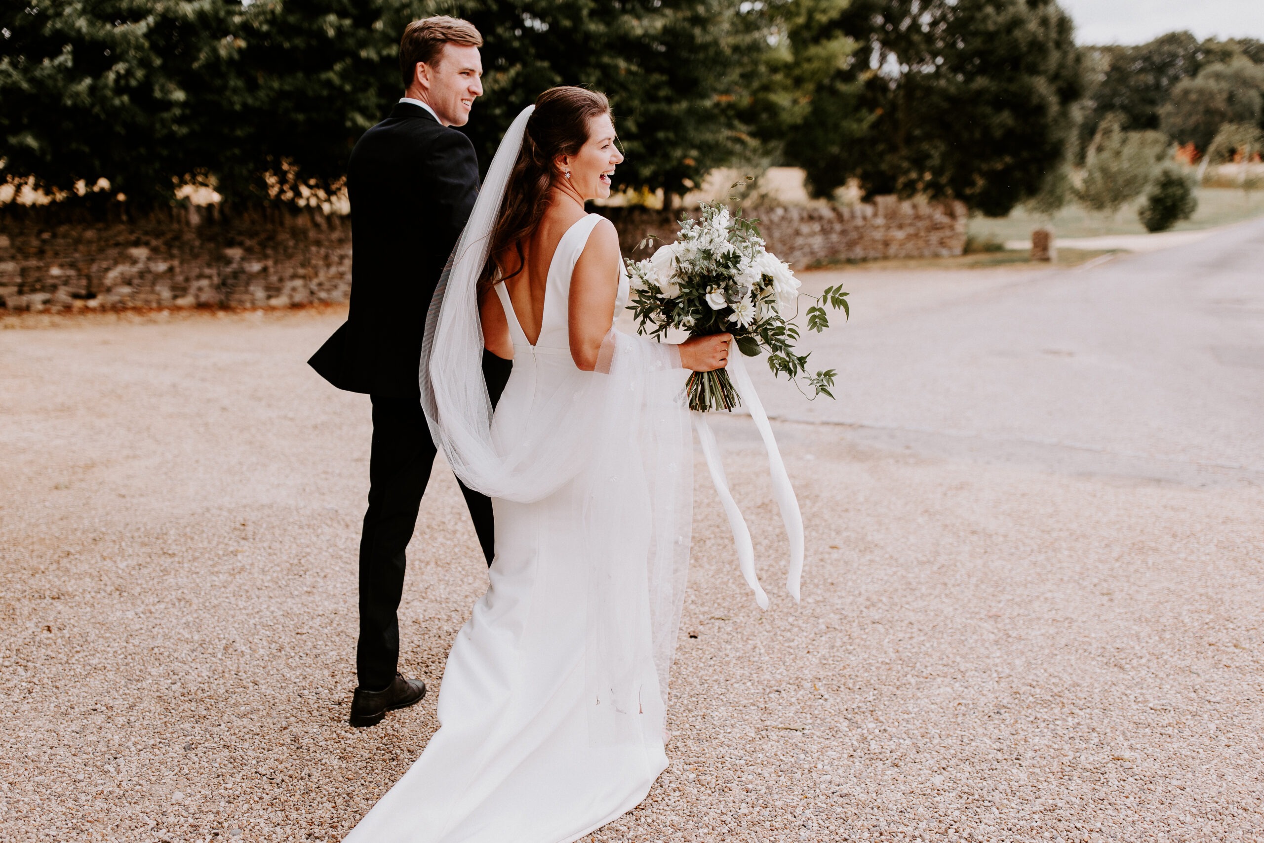 couple walking past Lapstone Barn