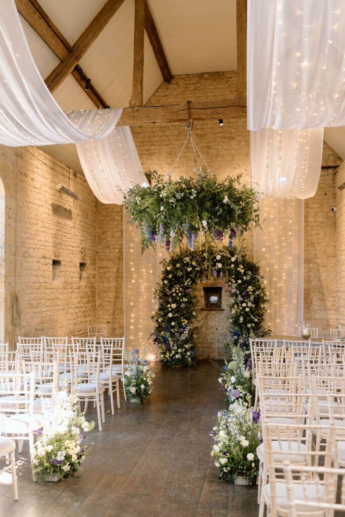 Floral installation at Lapstone Barn for spring wedding