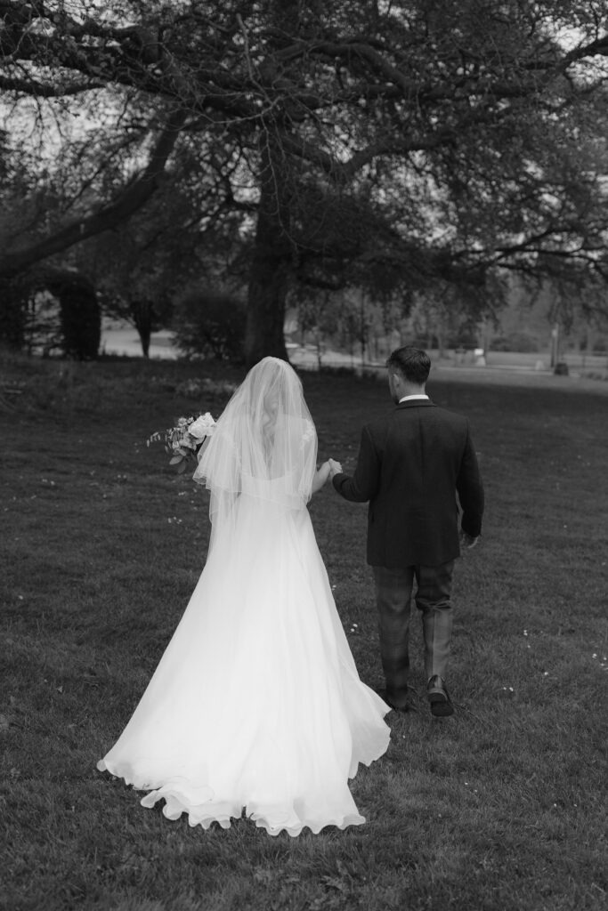 black and white suzanne neville wedding dress at the great barn aynho