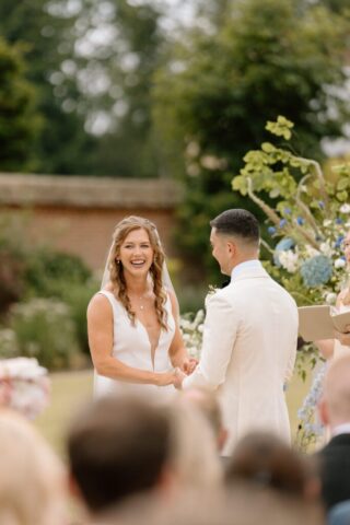 Rachel & Paul exchanging vows in the sunshine.