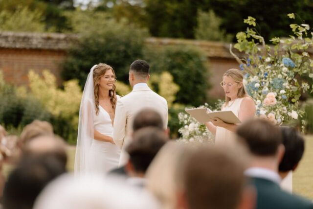 Rachel & Paul exchanging vows in the sunshine.