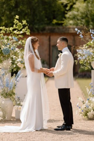 Rachel & Paul exchanging vows in the sunshine.
