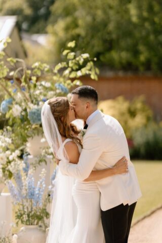 Rachel & Paul exchanging vows in the sunshine.