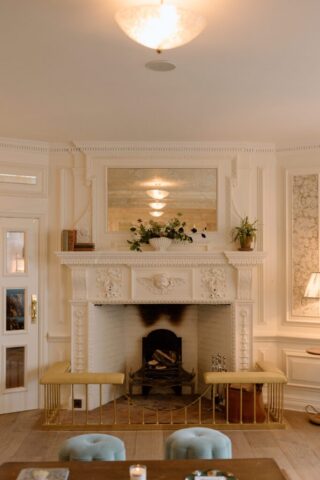 Reception room at Kin House with original fireplace