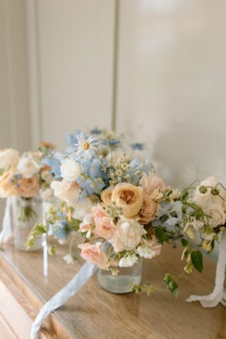 blue, peach, and ivory bouquet with roses and hydrangeas