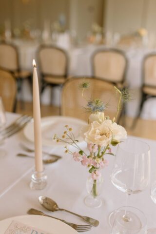 pastel floral centrepieces and elegant table styling.