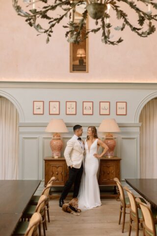Couple posing for photographs in main hall of Kin House