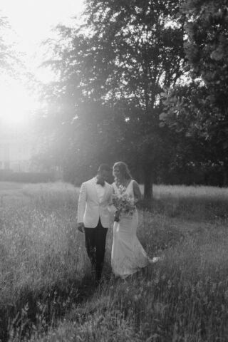 Newlywed couple taking stroll outdoors at Kin House