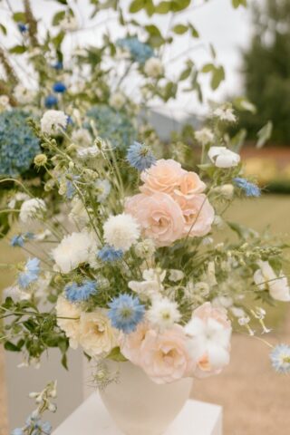 blue, peach, and ivory bouquet with roses and hydrangeas