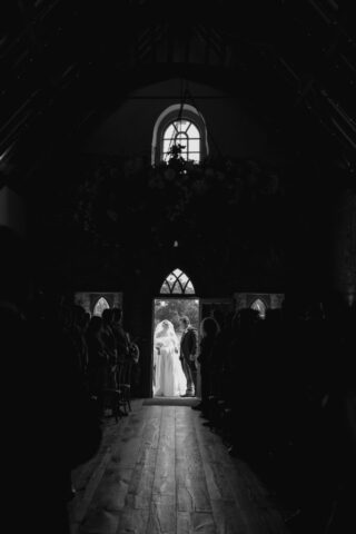 Bride in Milla Nova dress walking down the aisle at Ivy Lodge with her dad