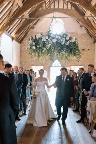 Bride in Milla Nova dress walking down the aisle at Ivy Lodge with her dad