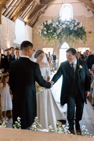 Bride in Milla Nova dress walking down the aisle at Ivy Lodge with her dad