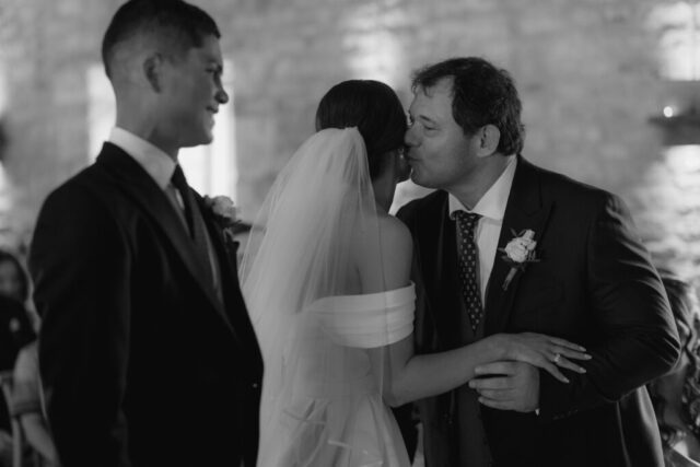 Bride in Milla Nova dress walking down the aisle at Ivy Lodge with her dad