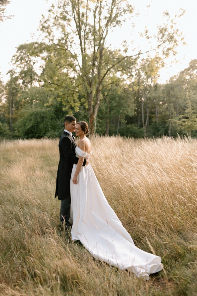 ride and groom portraits at golden hour in the Cotswolds countryside